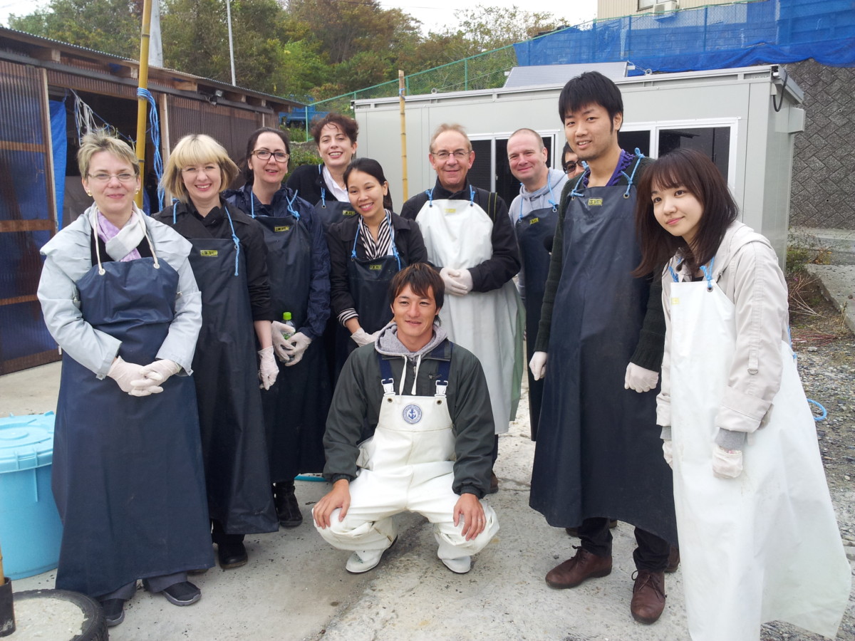 Members of the research team visiting Minamisanriku with a local fisherman